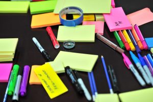 post it notes and colorful pens